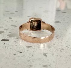 This antique Victorian Champagne Diamond Starburst Ring is truly a timeless piece. Featuring a signet style top with a starburst setting surrounding a gorgeous champagne diamond. This piece is crafted from 9 ct rose gold and features intricate beautiful tooling detail around the band, this ring is truly remarkable. Only 1 Available. This ring is a size 7.5 but can be sized for an additional fee. Click here to choose your needed size. If you choose to resize this ring please allow 3-4 weeks for i Rose Gold Signet Ring With Rose Cut Diamonds, Antique Rose Gold Jewelry With Single Cut Diamonds, Victorian Rose Gold Signet Ring For Anniversary, Starburst Ring, Band Necklace, Champagne Diamond, Antique Victorian, Custom Wedding, Timeless Pieces