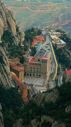 an aerial view of a city on top of a mountain