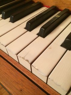 an old piano with black and white keys