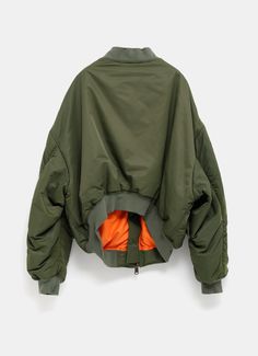 Balenciaga unisex bomber jacket in vegetable-dyed technical fabric with multiple styling possibilities but designed to be worn off the shoulder. Features leather tab zipper puller, cargo pocket on left sleeve with printed logo, two front snap flap pockets, ribbed trims, worn-out effect and contrasting lining. Made in Italy. Large fit, choose your regular size. Standard sizing for men. Cargo Pocket, Black Khakis, Color Khaki, Flap Pocket, Balenciaga, Off The Shoulder, Off Shoulder, Bomber Jacket, Zipper