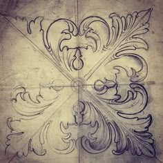 a drawing of an ornate design on a piece of paper with some writing in it