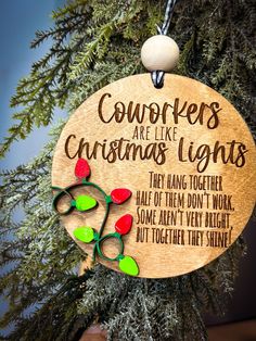 a christmas ornament hanging from a tree with the words cowboys are like christmas lights