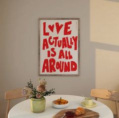 a white table with some food on it and a sign that says live actually is all around