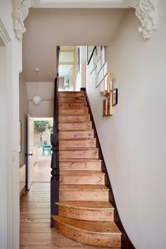 there is a wooden staircase in the house