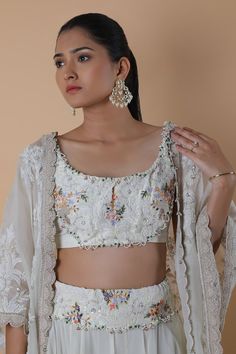 White lehenga with floral, thread, beads and pearls embroidery. Comes with a blouse and a cape. - Aza Fashions Fitted Sharara With Pearl Embroidery For Designer Wear, Fitted Pearl Embroidery Sharara For Designer Wear, Festive Wedding Blouse Piece With Pearl Embroidery, Bollywood Choli With Pearl Embroidery For Reception, Bollywood Style Choli With Pearl Embroidery For Receptions, Fitted Sharara With Pearl Embroidery For Reception, Bollywood Pearl Embroidered Choli For Reception, Traditional Pearl Embroidered Choli For Wedding, Fitted Palazzo Set With Pearl Embroidery For Reception