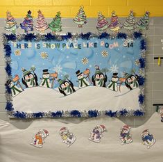 a bulletin board with snowmen on it