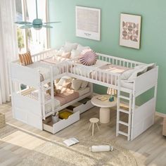 a child's bedroom with green walls and white furniture