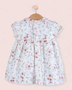 Our beautiful Bianca is hand smocked in a dressy flannel print. It features short puff sleeves and a Peter Pan collar trimmed with delicate lace. Fully lined with a button closure back. 100% Organic Cotton From France. Fully Lined in Cotton Delicate Machine Wash Cold, Flat Dry, Cool Iron, Dry Clean This dress runs lightly smaller, please size up for a better fit Short Sleeve Dress With Smocked Bodice For Garden Party, Garden Party Dress With Smocked Bodice And Short Sleeves, Summer Dress With Lace Trim And Cap Sleeves, Short Sleeve Pastoral Summer Dresses, Pastoral Style Short Sleeve Summer Dresses, Smock Dresses With Flutter Sleeves For Daywear, Cute Short Sleeve Dress With Smocked Back, Short Sleeve Printed Dresses For Daywear, Short Sleeve Printed Day Dresses