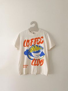 Coffee Club Tee, Foodie Coffee Lover Aesthetic Graphic Tee, Trendy Streetwear Shirt, Comfort colors graphic tee, women's style, women's outfits, Shirt Outfit Ideas, Tshirt Design Ideas - Jasaust Store Trendy Tee Shirts Design, T Shirt Prints Aesthetic, Cool Oversized Shirts, Minimal Graphic Tee, Oversized T-shirt, Streetwear Prints, Coffee Lover Aesthetic, Cafe Merch, Aesthetic Tees