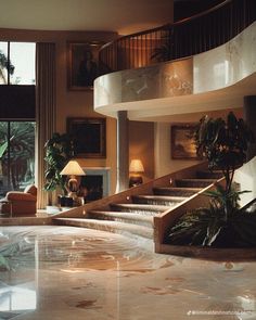 a living room filled with lots of furniture next to a fire place and large windows