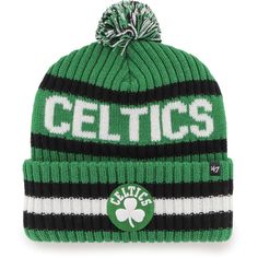 a green and white knitted hat with the word celtics on it's side