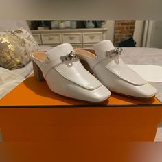 White Leather Hermes Miles. Worn Twice - See Photos Of Soles For Proof Of Minimal Wear. Excellent Condition With No Flaws. Comes With Signature Orange Hermes Box, Shoe Bags And Hermes Card. Please Let Me Know If You’d Like To See Additional Photos Hermes Mules, Hermes Shoes, Hermes Box, Shoe Bags, Mule Clogs, Mules Shoes, White Leather, Clogs, Loafers