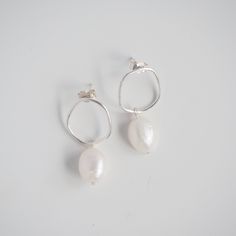 Our Wobble Earrings | Pearls are a perfect statement earring. With organic minimalist shapes, this pair is destined to be the focal point of any outfit. Our Wobble Earrings | Pearls have a lovely movement allowing the pearls to flutter below your ear. Perfect for those who love all things minimalist and make a lovely gift to your bridesmaid, bestie or even as a special treat to yourself. DETAILS ~ ear post and butterfly back fixture ~ pearls approximately measure 12mm ~ all pearls vary in shape and colour. We can not guarantee that any two will be alike or exactly like the pictures shown. Pearls are very delicate, take care of these babies. ~ total drop length is approximately 3cm ~ available in Sterling Silver, 9ct Yellow Gold and 9ct White Gold ~ is your order a gift? a handwritten note Minimalist Shapes, Dainty Jewellery, Silver Pearl Earrings, Professional Jewelry, Statement Earring, Jewellery Gift, Favorite Rings, Dainty Jewelry, Silver Pearls