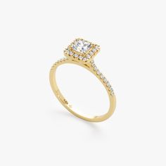 a yellow gold ring with a square shaped diamond in the center and two rows of diamonds around it