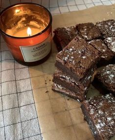 some brownies and a candle on a table