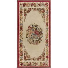 an oval rug with flowers and leaves on the center, in red and beige colors