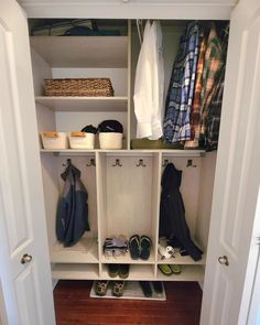 an open closet with shoes and other items