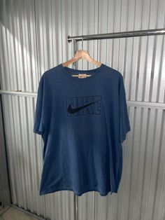 Vintage 90s Nike tee -Size: XL -Condition: 9/10 near perfect  No major flaws 90s Inspired Blue Cotton T-shirt, 90s Oversized Logo Print T-shirt, Oversized 90s T-shirt With Logo Print, Blue Oversized 90s Style Top, 90s Oversized Blue Top, 90s Style Oversized Blue Top, Oversized 90s Blue Top, 90s Blue Oversized Top, Oversized 90s Inspired Streetwear T-shirt