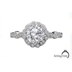 This vintage engagement mounting features a shank and scalloped round halo lined with sparkling diamonds set in high polished 14 karat white gold. The diamond total weight equals .16ct. This ring will accommodate a 1.00 ct. round center stone. Center diamond is not included in the price. Cubic Zirconia Halo Ring, White Gold Halo Ring With Platinum Setting, Diamond White Halo Ring For Promise, Diamond Halo Ring With Round Cut, White Gold Halo Ring With Platinum, Dazzling Round Cut Halo Ring, Classic Diamond White Halo Ring, Anniversary Halo Ring In Diamond White With Halo Setting, Platinum Halo Ring For Anniversary