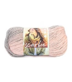 a skein of yarn with the word sparkle on it in pink and grey colors