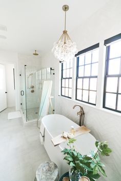 a white bath tub sitting next to a window