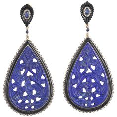 Cast in 18-karat gold & sterling silver, these beautiful drop earrings are set with 62.24 carats lapis, 16.63 carats black onyx, .68 carats blue sapphire and 1.14 carats of sparkling diamonds. FOLLOW MEGHNA JEWELS storefront to view the latest collection & exclusive pieces. Meghna Jewels is proudly rated as a Top Seller on 1stDibs with 5 star customer reviews. All items manufactured by us are handmade and can be customized or redesigned. Composition Gold Weight(Gms)-2.53 Silver Weight(Gms)-18.75