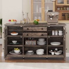 a wooden cabinet with plates and bowls on it in front of a kitchen counter top