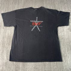 a black t - shirt with the words bwp on it and two crossed swords