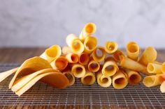 several pieces of pasta sitting on top of a metal grate next to each other