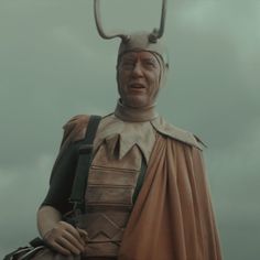 a statue of a man with horns on his head