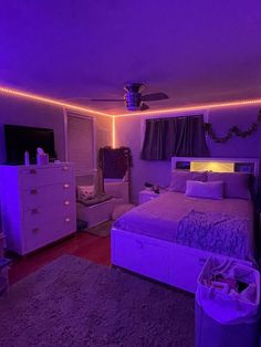 a bed room with a neatly made bed and purple lighting