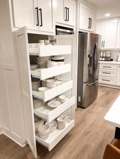 the kitchen is clean and ready to be used as a storage area for dishes, cups, and other items