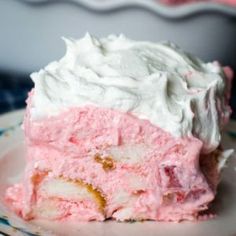 a close up of a piece of cake on a plate with frosting and icing