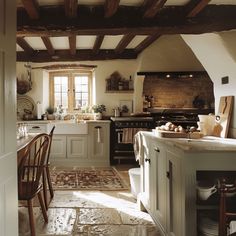 A charming English countryside kitchen that incorporates modern conveniences, creating a space that is both timeless and efficient English Country Estate Kitchen, Tudor Style Kitchen Ideas, Cotswold Cottage Kitchen, Old English Cottage Interiors Kitchen, Old World Cottage Interior, English Country Decor Kitchen, British Farmhouse Interiors, Cotswolds Interior Design, English Countryside Home Interior