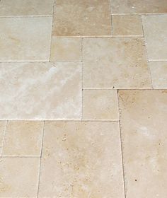 a white toilet sitting on top of a tiled floor