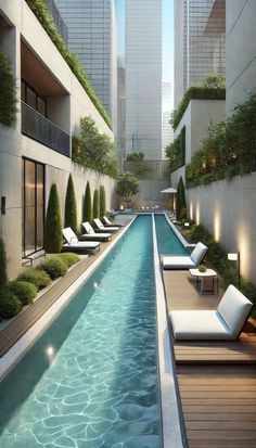 an outdoor swimming pool with lounge chairs and trees on either side, surrounded by tall buildings