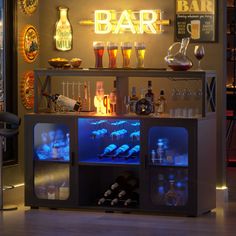 an illuminated bar with bottles and glasses on it