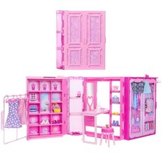 a pink doll house with furniture and accessories