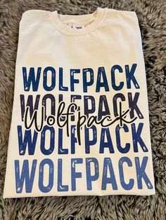 Get this popular new Wolfpack stacked text shirt and show off your school spirit in style!  Each shirt is printed in-house by me using high-quality materials on a Comfort Colors shirt, known for its exceptional comfort, style, and durability. Available in unisex sizes S to 3X, and youth sizes, we've got you covered regardless of your preferred fit. The Bulldogs stacked text Shirt features a classic crew neck and short sleeves, making it suitable for year-round wear. The flattering silhouette ens School Spirit Shirt With Letter Print For College Events, School Spirit Shirt With Letter Print, Back To School Spirit Shirt With Text Print, School Spirit Shirt With Graphic Print For College Events, Graphic Print Shirt For College Events, School Spirit T-shirt With Lettering For Fans, Fan Merchandise T-shirt With School Spirit Lettering, School Spirit Cotton Shirt With Text Print, Cotton School Spirit Shirt With Text Print