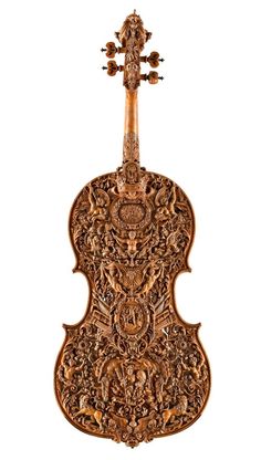 an old violin with intricate carvings on it