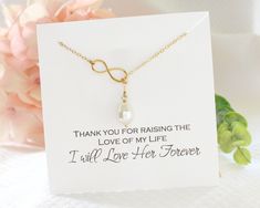 A lovely gift for your mom or Mother in Law on your wedding day or rehearsal dinner, this sparkly and timeless Infinity Y lariat style necklace features a pave cross at one end that slips through the infinity link on the opposite end, the cross can be move for a longer or shorter style and is secured with a small ring. The chain has a lovely delicate look but is very durable cable chain, perfect for everyday wear. P R O D U C T * D E T A I L S * Material: Sterling Silver or 14K Gold or Rose Gold Adjustable Lariat Necklace For Anniversary, Mother's Day Wedding Pearl Necklace With Pendant, Infinity Necklaces For Wedding On Mother's Day, Gold Lariat Necklace For Mother's Day, Customizable Infinity Necklace For Mother's Day, Personalized Infinity Necklace For Mother's Day, Mother's Day Heart-shaped Pearl Pendant Necklace, Bride Pearl Necklace, Lariat Style Necklace