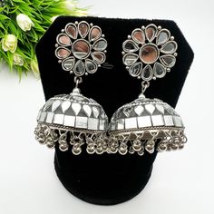 You will absolutely love this stunner mirror oxidized earrings. They are perfect length and suits most face types.  *Handmade in India Bollywood Style Silver Metal Danglers, Silver Metal Bollywood Danglers, Silver Oxidized Jhumkas For Party, Silver Chandbalis For Navratri Party, Silver Jhumkas For Navratri Party, Silver Danglers For Navratri Party, Silver Danglers For Party And Navratri, Silver Danglers For Party During Navratri, Mirror Work Danglers As A Gift