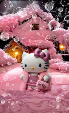 a hello kitty doll sitting in front of a pink house with bubbles all around it