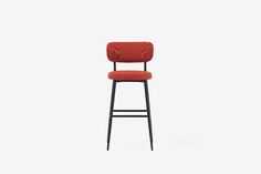 a red chair with a black frame and backrest, against a white background the seat is upholstered