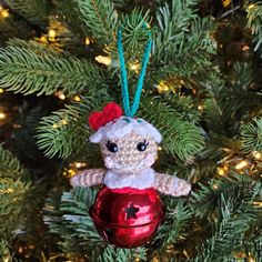 a crocheted ornament hanging from a christmas tree