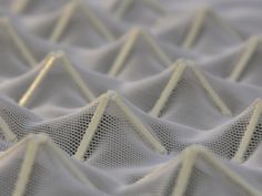 close up view of white fabric with wavy lines