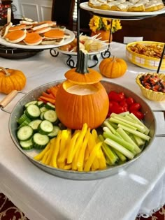 a platter filled with lots of different types of food on top of a table