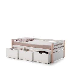 a white bed with drawers underneath it