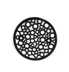 a black and white circular object on a white surface with circles in the center,