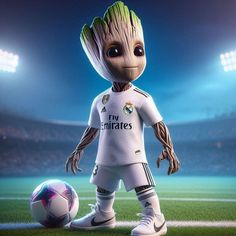 a baby groote standing next to a soccer ball